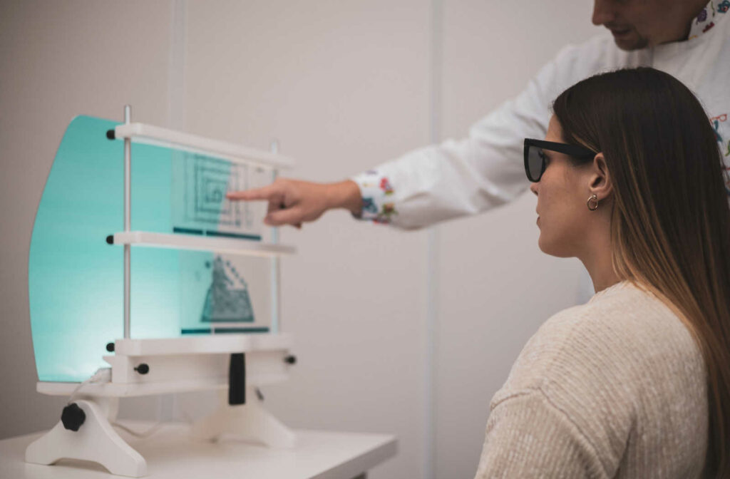 A woman goes through vision therapy exercises as instructed by her eye doctor.