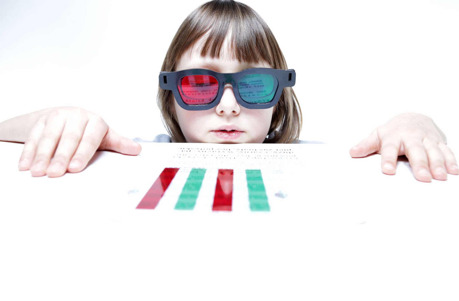 A child doing red green activities for vision therapy.