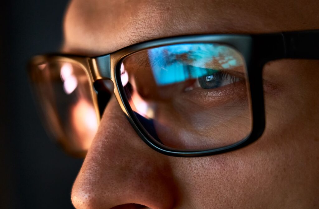 A close-up of a person wearing a pair of computer glasses.